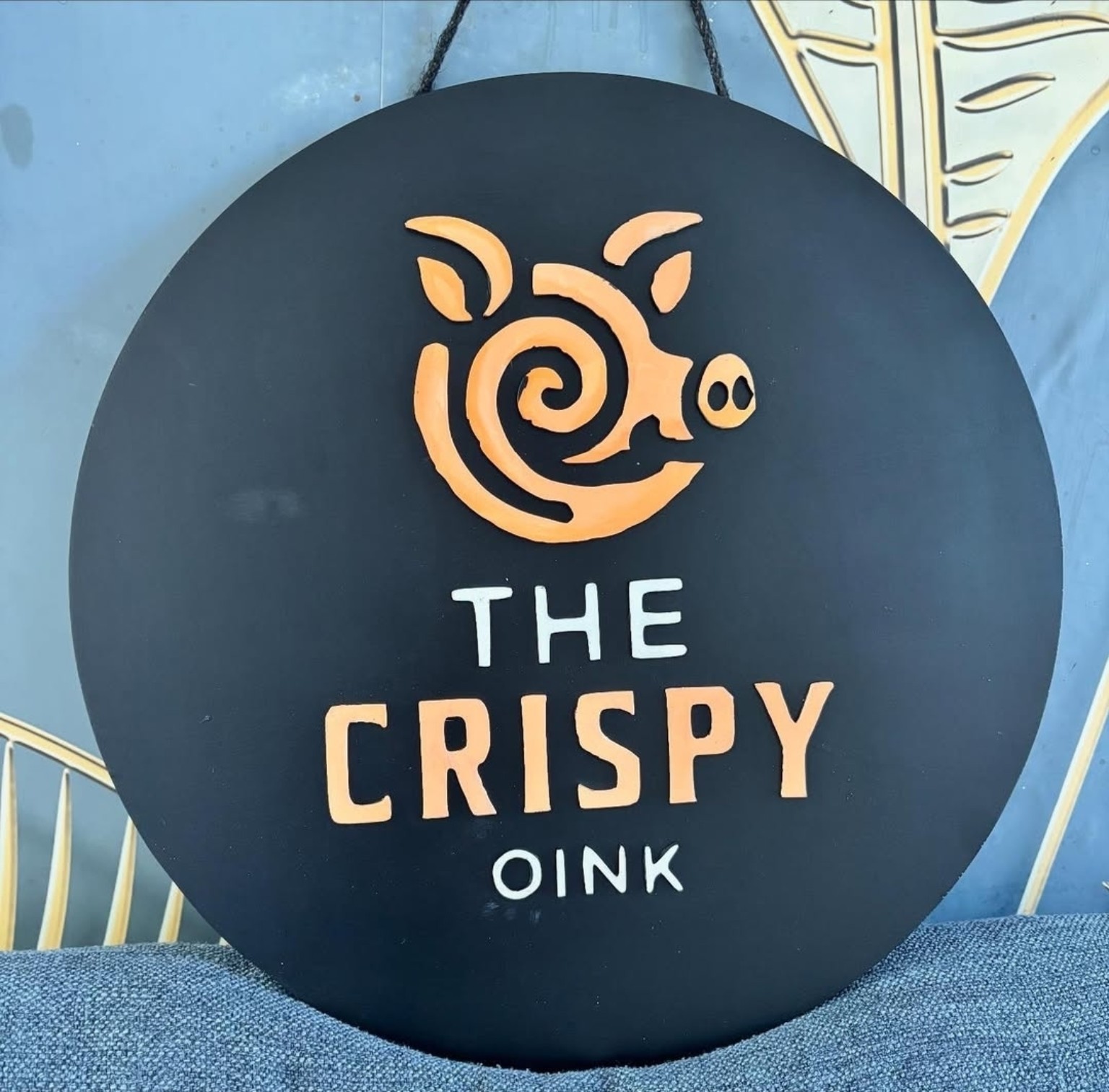 The Crispy Oink wooden sign